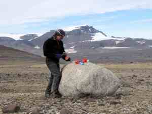 Sampling a granite erratic boulder for cosmogenic nuclide dating, NE Antarctic Peninsula, 2011. Photo credit: Bethan Davies